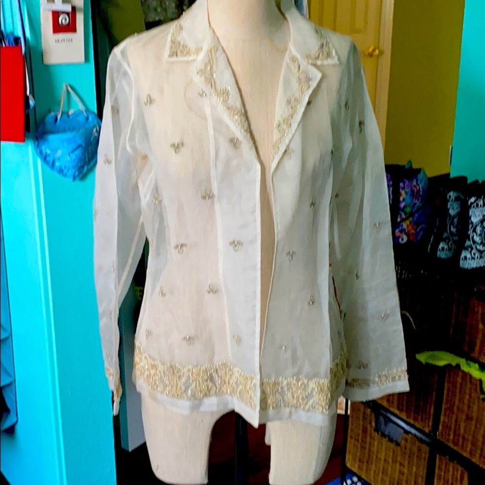 Throw over buttonless beaded beautiful blouse.